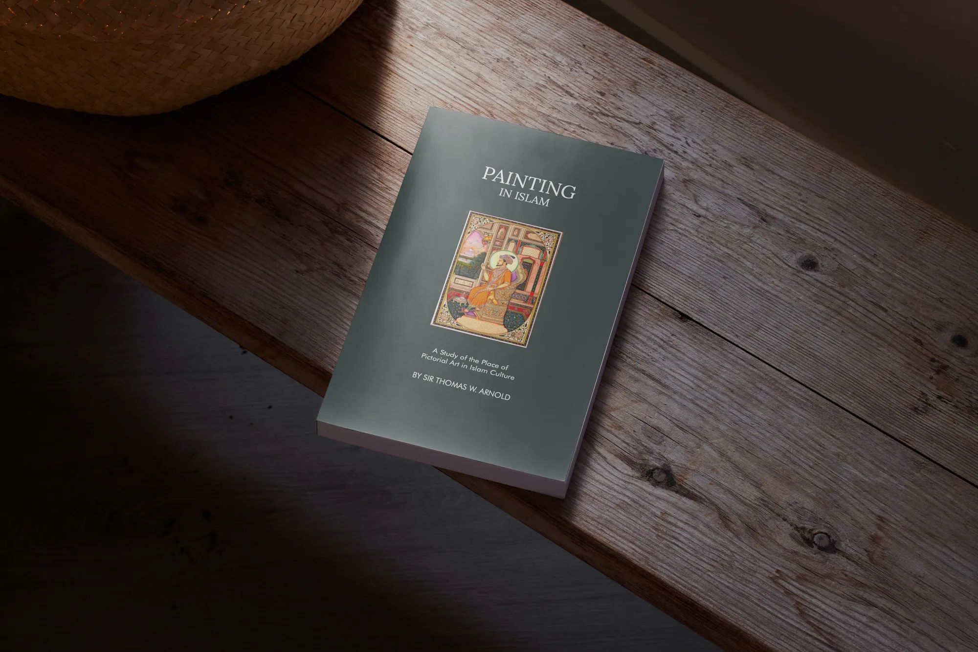 Painting in Islam redesigned book on a wooden bench