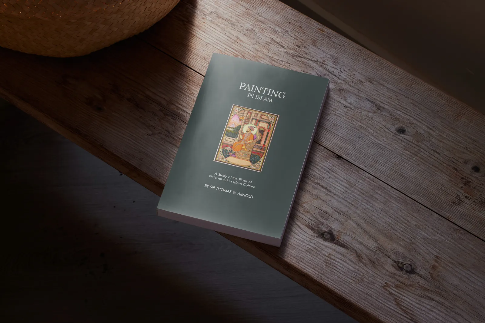 Painting in Islam book redesign mockup on a wooden bench